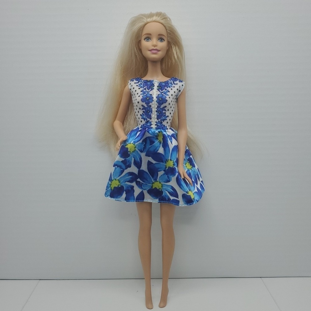 Mattel Barbie Doll Dressed in a Blue Floral Fashion Dress- Blonde Hair Blue Eyes